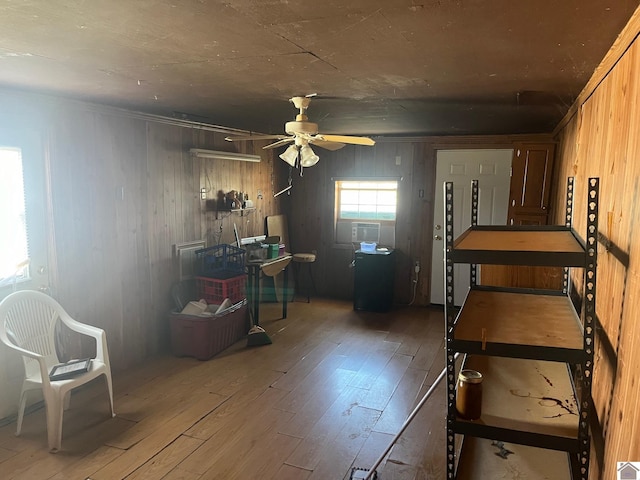 bedroom featuring wooden walls and wood-type flooring