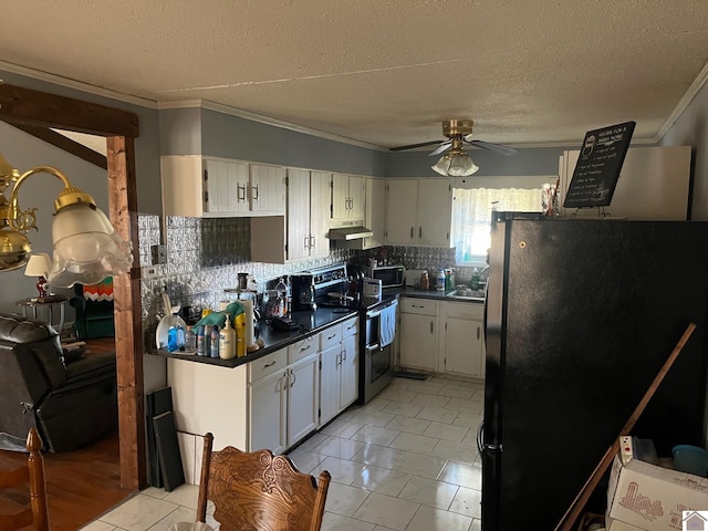 kitchen with electric range, ornamental molding, ceiling fan, decorative backsplash, and black refrigerator