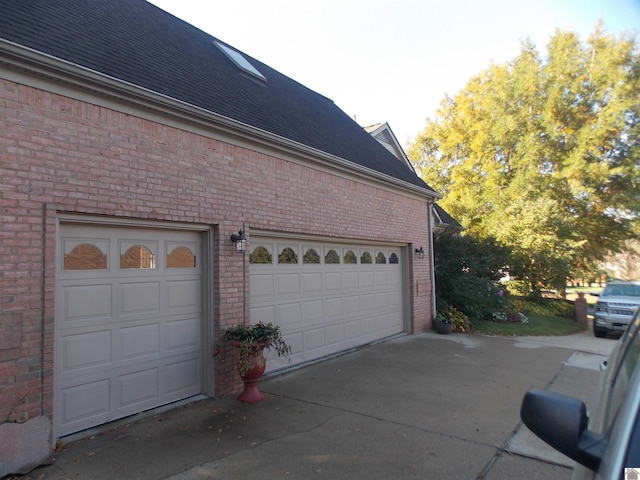 view of side of home with a garage