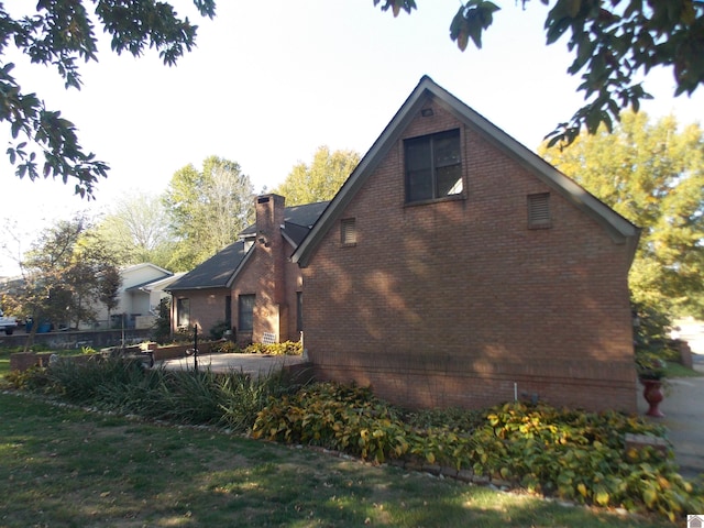 view of property exterior featuring a yard