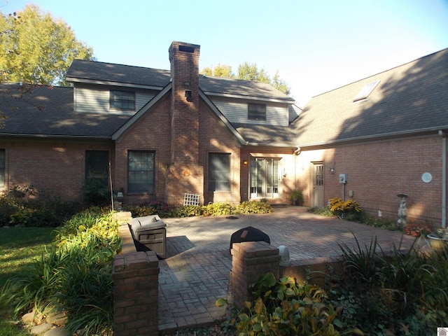 rear view of house with a patio