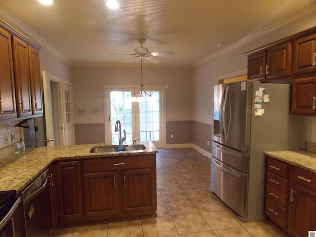 kitchen with light tile patterned floors, appliances with stainless steel finishes, light stone countertops, crown molding, and sink