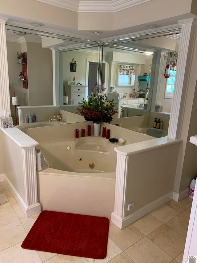 bathroom with vanity, crown molding, tile patterned flooring, and a washtub