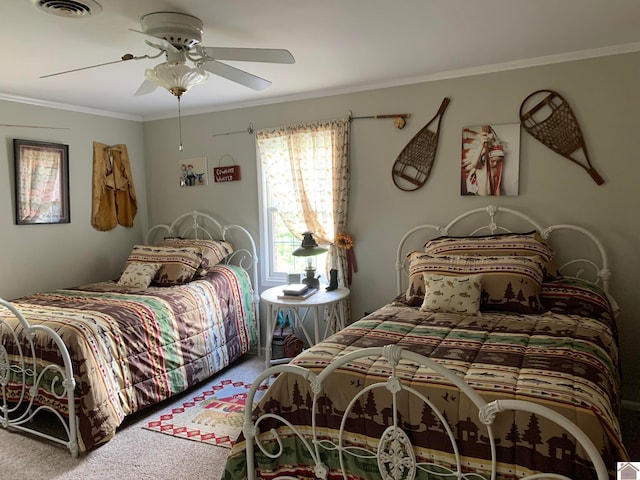 bedroom with crown molding, carpet flooring, and ceiling fan