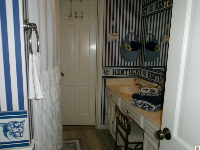 bathroom with vanity and hardwood / wood-style floors