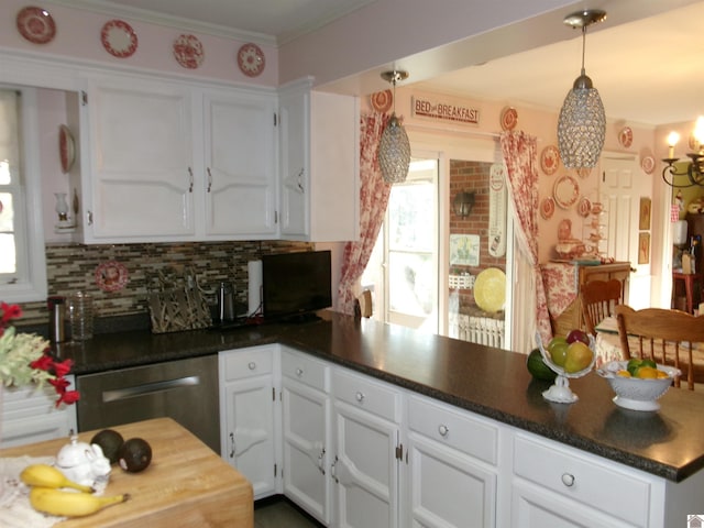 kitchen with decorative backsplash, kitchen peninsula, pendant lighting, stainless steel dishwasher, and white cabinets