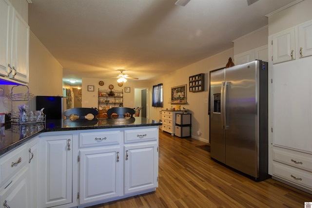 kitchen with white cabinets, hardwood / wood-style floors, and stainless steel refrigerator with ice dispenser