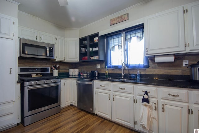 kitchen with sink, appliances with stainless steel finishes, and white cabinetry