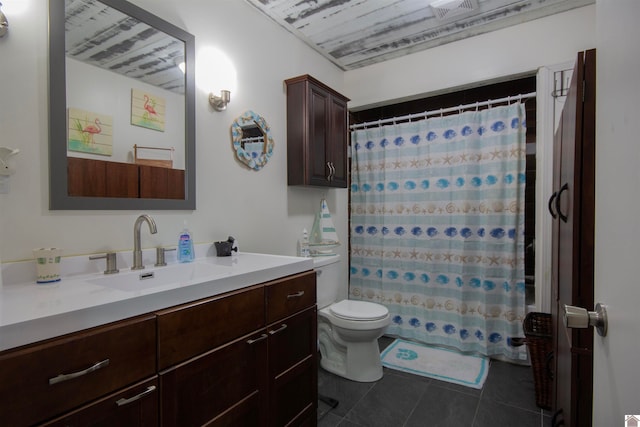 bathroom featuring vanity, a shower with curtain, toilet, and tile patterned flooring