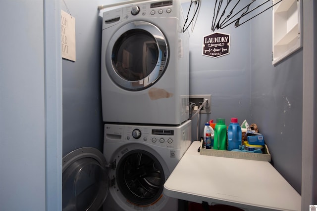 laundry room featuring stacked washer and dryer