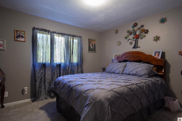 carpeted bedroom with a textured ceiling