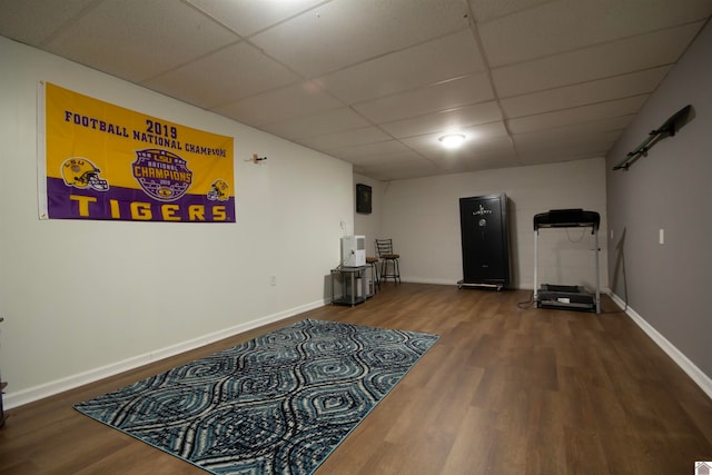 interior space with hardwood / wood-style floors and a paneled ceiling