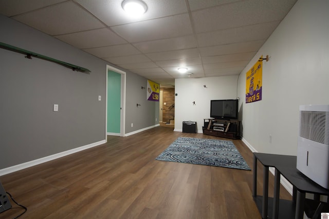 unfurnished room featuring a paneled ceiling and hardwood / wood-style flooring