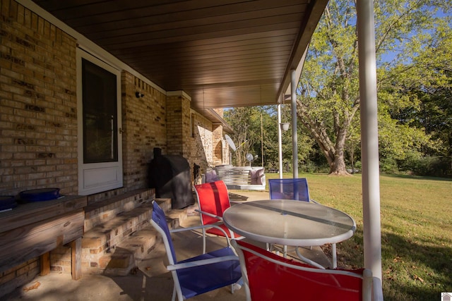 view of patio featuring a grill