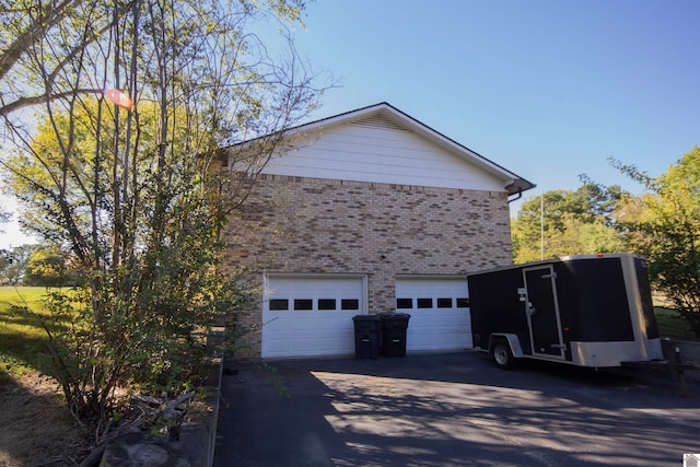 view of side of home with a garage