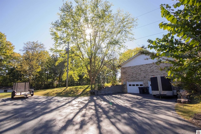 view of patio / terrace with an outbuilding and a garage