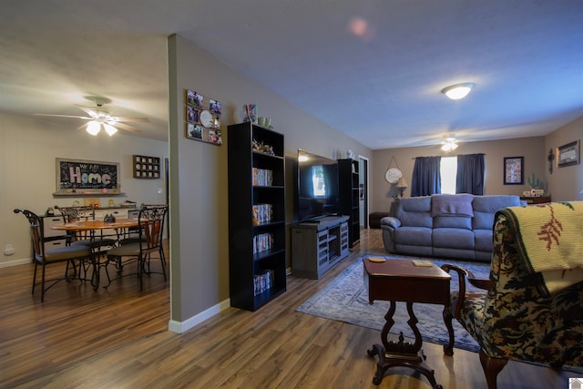 living room featuring hardwood / wood-style flooring and ceiling fan