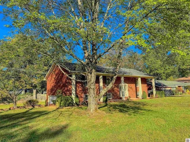 view of front of property with a front lawn