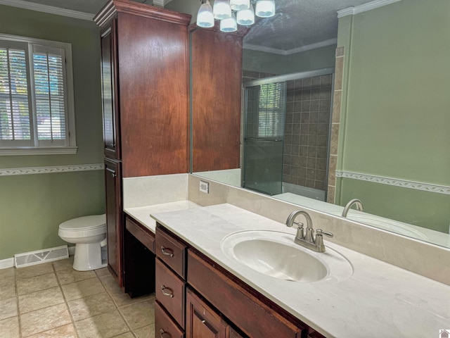 bathroom with toilet, a shower with shower door, crown molding, vanity, and a textured ceiling