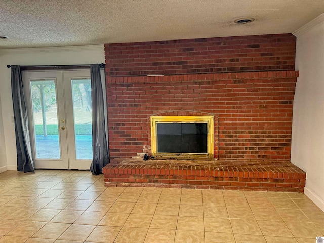 1516 Canterbury Dr, Murray, KY 42071 - unfurnished living room with french doors, a textured ceiling, a brick fireplace, light tile patterned flooring, and crown molding