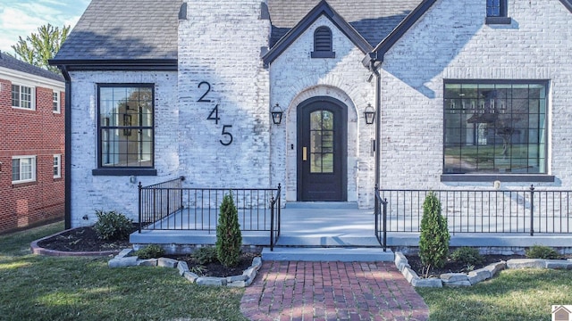 property entrance with a yard