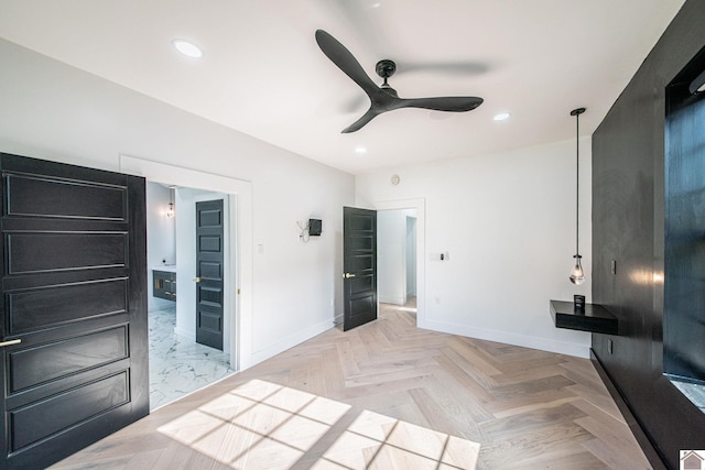 unfurnished bedroom featuring light parquet flooring and ceiling fan