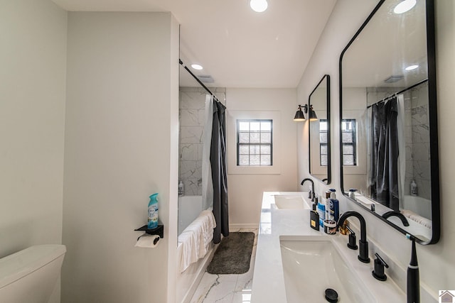 full bathroom featuring vanity, toilet, and shower / bath combo