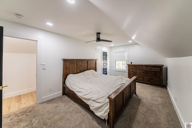 bedroom with ceiling fan, carpet, and lofted ceiling