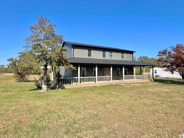 farmhouse featuring a front yard and a porch