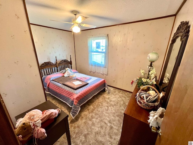 carpeted bedroom with a textured ceiling and ceiling fan