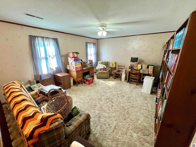 misc room with ceiling fan, carpet flooring, and a textured ceiling