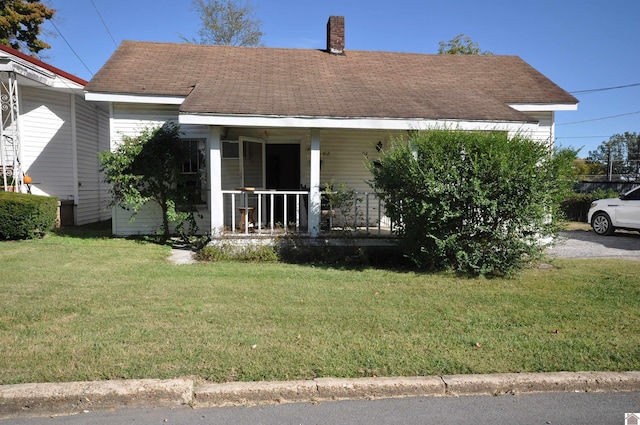 bungalow-style house featuring a front yard and a porch