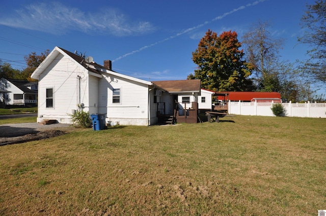 back of house featuring a yard