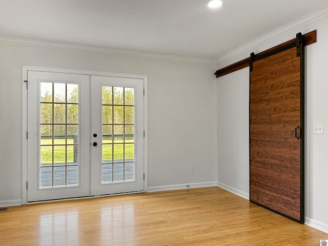 entryway with light hardwood / wood-style flooring, french doors, and crown molding