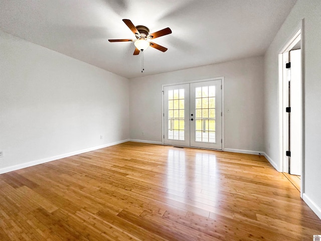 spare room with french doors, a textured ceiling, light wood-type flooring, and ceiling fan