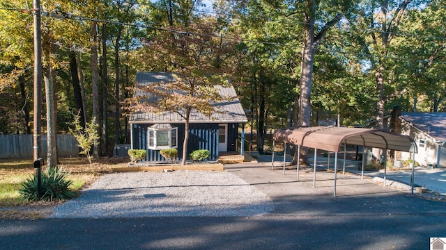 view of front of property featuring a carport