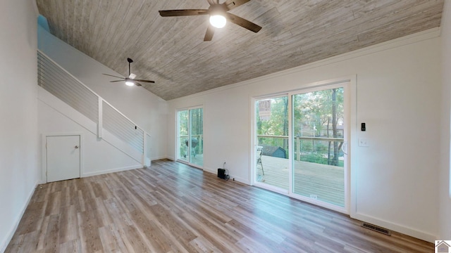 unfurnished living room with lofted ceiling, light wood-type flooring, and ceiling fan