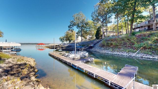 dock area featuring a water view