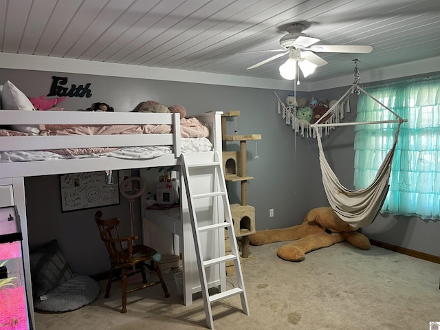 bedroom featuring carpet floors, wooden ceiling, and ceiling fan