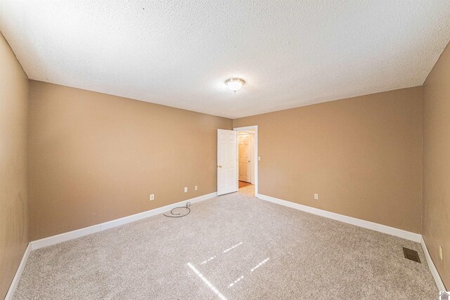 9618 Scale Rd, Benton, KY 42025 - carpeted spare room featuring baseboards, a textured ceiling, and visible vents