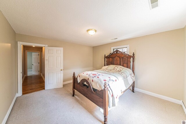 9618 Scale Rd, Benton, KY 42025 - carpeted bedroom with a textured ceiling, visible vents, and baseboards