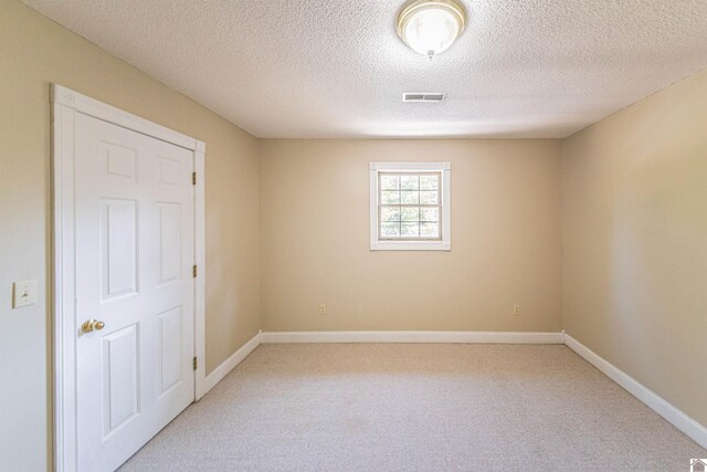 9618 Scale Rd, Benton, KY 42025 - unfurnished room with a textured ceiling, visible vents, baseboards, and light carpet