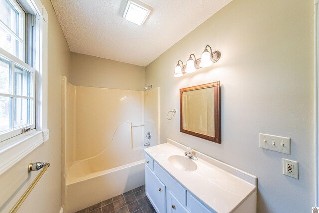 9618 Scale Rd, Benton, KY 42025 - full bathroom featuring shower / washtub combination, vanity, a wealth of natural light, and a textured ceiling
