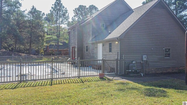9618 Scale Rd, Benton, KY 42025 - view of side of home with a lawn, a patio, a fenced backyard, and roof with shingles