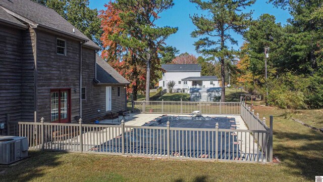 9618 Scale Rd, Benton, KY 42025 - view of swimming pool with central AC unit, french doors, fence, a yard, and a patio