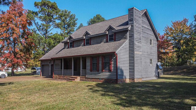 9618 Scale Rd, Benton, KY 42025 - view of front of home with a chimney, a front lawn, roof with shingles, and a garage