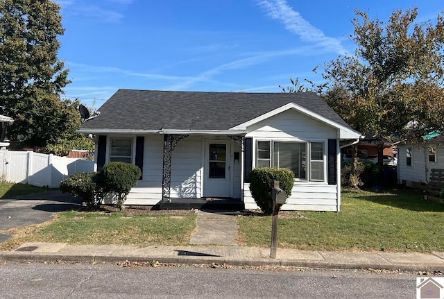 bungalow-style house with a front lawn