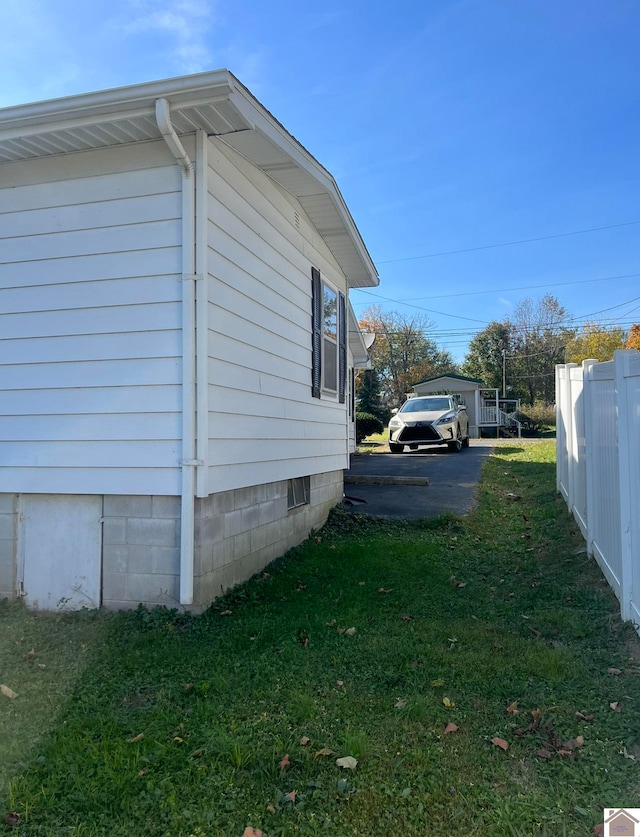 view of home's exterior with a lawn