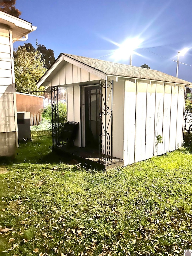 view of outdoor structure with a lawn