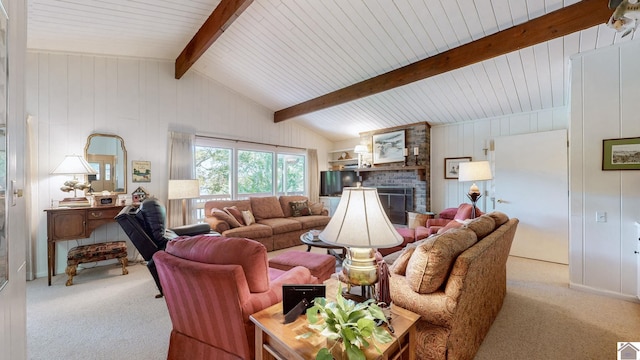 carpeted living room featuring lofted ceiling with beams and a brick fireplace